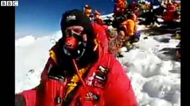 ILLEGAL CALL. British climber Daniel Hughes calls BBC from the summit of Mt. Everest using his smartphone. Screengrab courtesy of youtube.com/BBCWorldNewsWatch