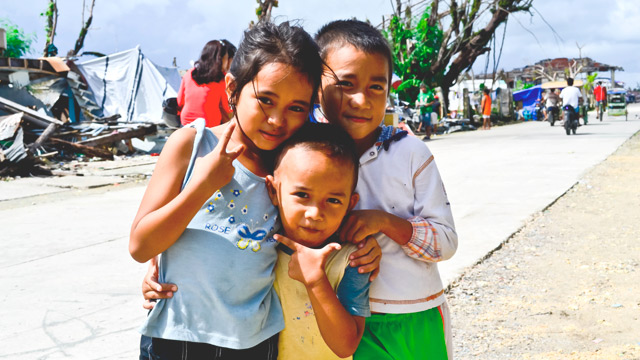 FAMILIAR SMILES. Post-Yolanda devastation will not dampen the Christmas spirit of children in Salcedo. Photo by Jim Duran