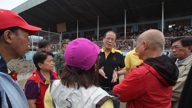 WANTING ANSWERS. President Aquino orders an investigation of local government's disaster response after visiting Compostela Valley and Davao Oriental. Aquino observed that evacuation centers were built in flood-prone areas. Photo by Malacañang Photo Bureau 