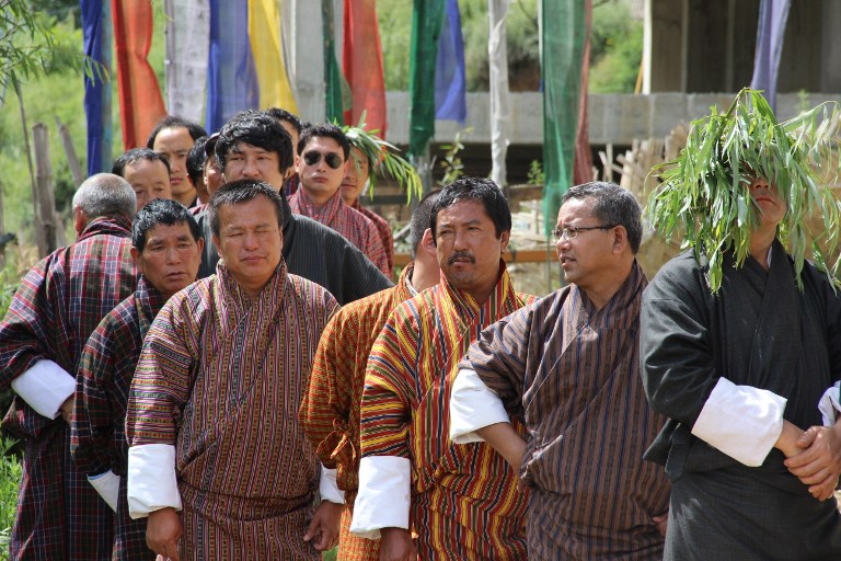 BHUTAN VOTES. Bhutanese men wait in line to cast their votes at a polling station in Thimphu on July 13, 2013. Photo by AFP/Upasana Dahal