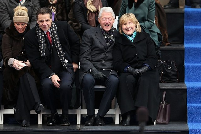SPECIAL GUESTS. Hillary and Bill Clinton (right) sit with New York Governor Andrew Cuomo and his girlfriend Sandra Lee (left) as they watch ceremonies for New York City's 109th Mayor Bill de Blasio on January 1, 2014 in New York City. Photo by Spencer Platt/Getty Images/AFP