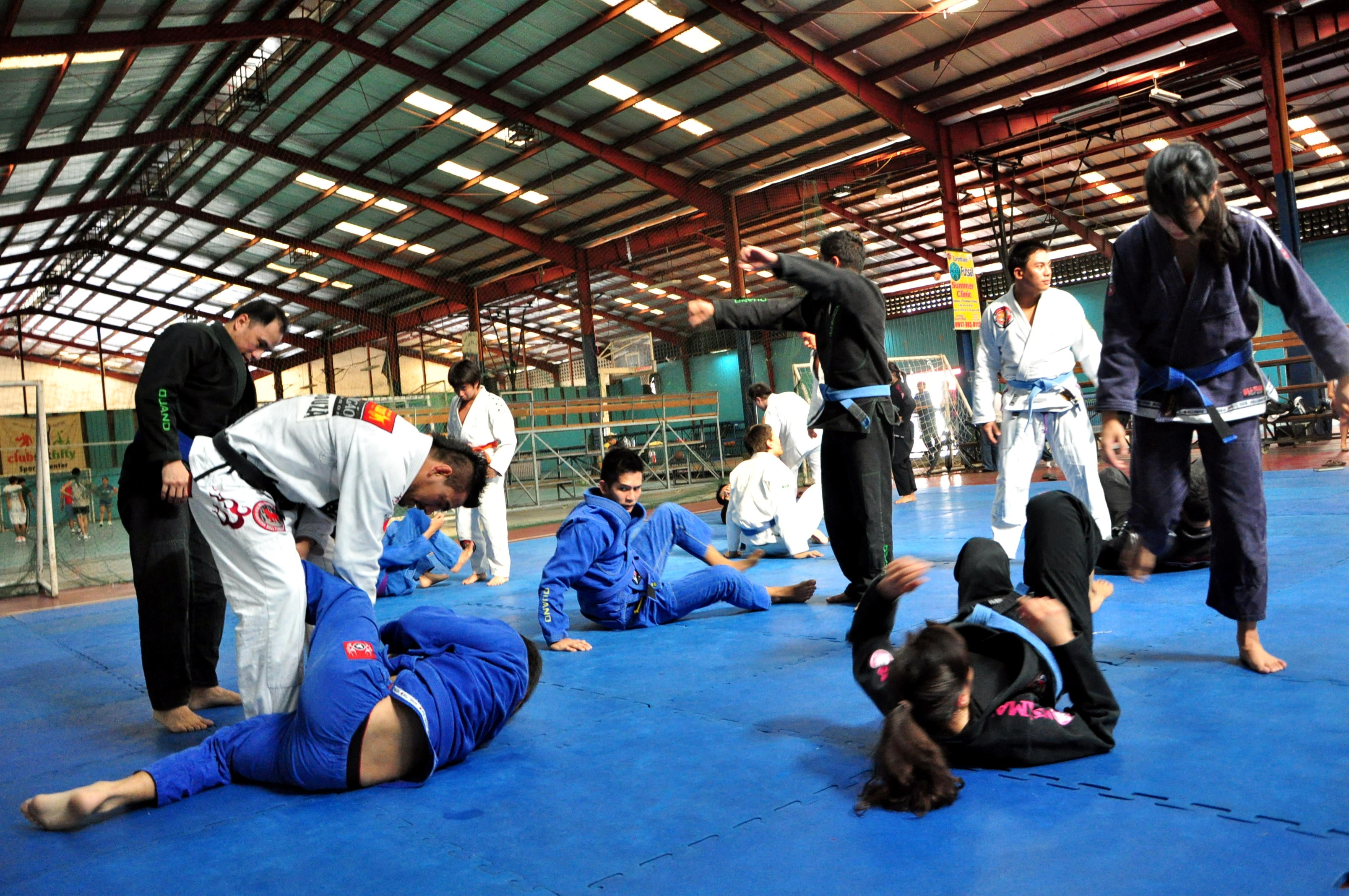 IN ACTION. Marcos assists seminar attendees as they practice their newly learned jiu-jitsu techniques. April 22, 2012. Loj Guinmapang.