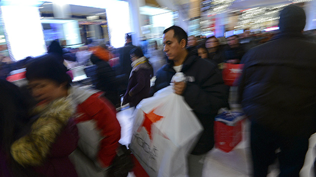 OFFLINE. Shoppers fill the aisles at a Macy's department store on Thanksgiving night in New York, USA, 28 November 2013. Photo by EPA/Peter Foley
