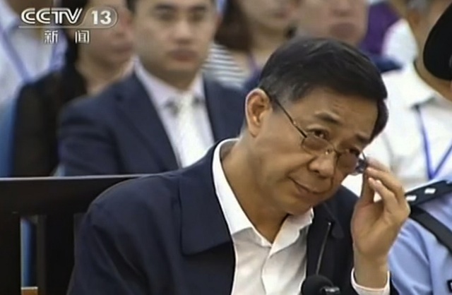 FACING TRIAL. This screen grab taken from CCTV footage released on August 26, 2013 shows ousted Chinese political star Bo Xilai looking on as he stands on trial in the Intermediate People's Court in Jinan, east China's Shandong province. AFP Photo / CCTV