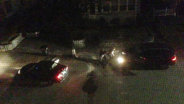 SHOOTOUT. The Tsarnaev brothers in Watertown, hiding behind their carjacked vehicle. Photo by Andrew Kitzenberg of getonhand.com