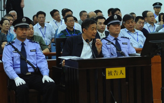 Former regional leader Bo Xilai (front, C) standing trial for the third day at Jinan Intermediate People's Court, as former police chief of Chongqing municipality Wang Lijun (not pictured) speaks as witness in Jinan, Shandong province, China, 24 August 2013. EPA/Jinan Intermediate People's Court / Handout