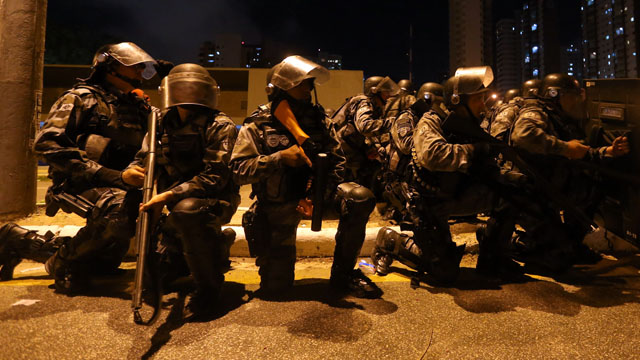 LOADED FOR BATTLE. Brazil police get ready for protesters. Photo by EPA/Fernando Bizerra Jr.