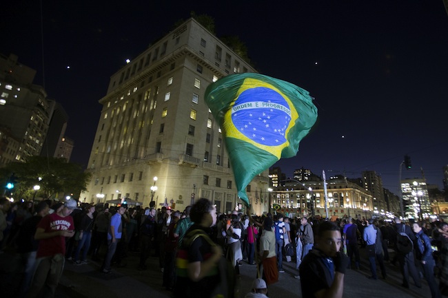 ANGER IN THE STREETS. Thousands of Brazilians protest against high public transportation costs and the billions of dollars spent on the 2014 World Cup and the 2016 Olympic Games in Rio, at the City Hall in Sao Paulo, Brazil, 18 June 2013. Photo by Sebastiao Moreira/EPA