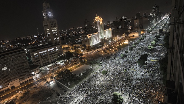 ANGER IN THE STREETS. Several hundred thousand Brazilians attend a protest against against corruption and price hikes in Rio de Janeiro, Brazil, 20 June 2013. Photo by Oliver Weiken/EPA