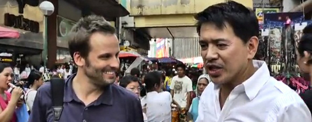 IN THE HEART OF MANILA. Brillante Mendoza with 'Around the World with Voyager' host Scott Woodward. Screen grab from YouTube (jwsvoyager)