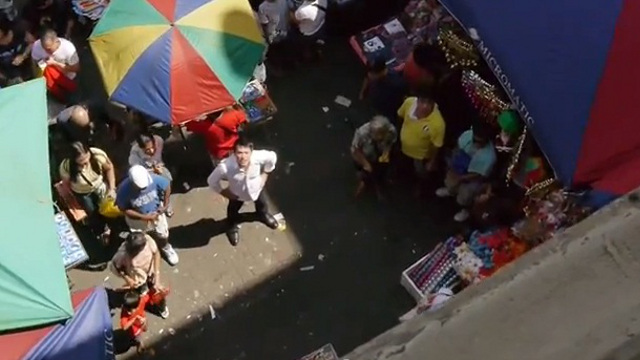 MANILA MAN. The filmmaker in the midst of a bustling street in Quiapo. Screen grab from YouTube (jwsvoyager)