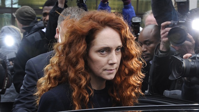 FACING TRIAL. In this file photo, former Chief Executive of News International, Rebekah Brooks (C) leaves City of Westminster Magistrates Court in London, Britain, 29 November 2012. EPA/Facundo Arrizabalaga