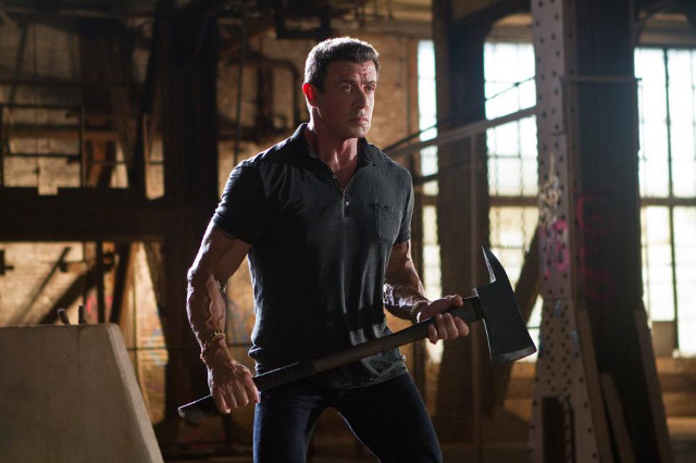 Stallone shows off how fit he still is in the axe fight scene