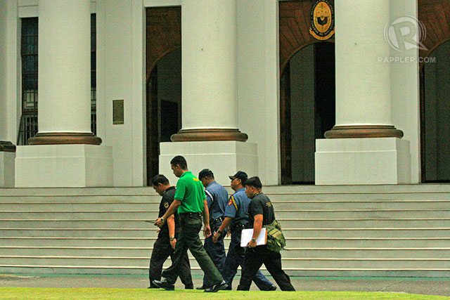NO BOMBS FOUND. Members of the Manila Police District bomb squad after inspecting the buildings of both Court of Appeals and the DOJ. Photo by Rappler/Arcel Cometa