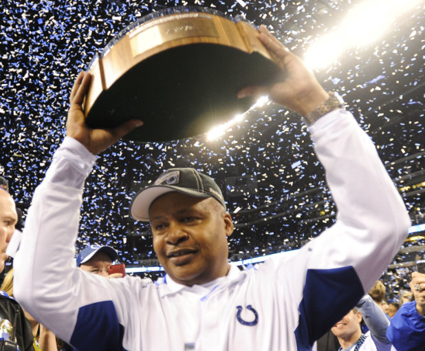 NEW SHERIFF IN TOWN. Jim Caldwell hoists the Lamar Hunt Trophy over his head after leading the Colts to the American Football Conference Championship in 2010. Can he bring similar success to Detroit? Photo by Tannen Maury/EPA