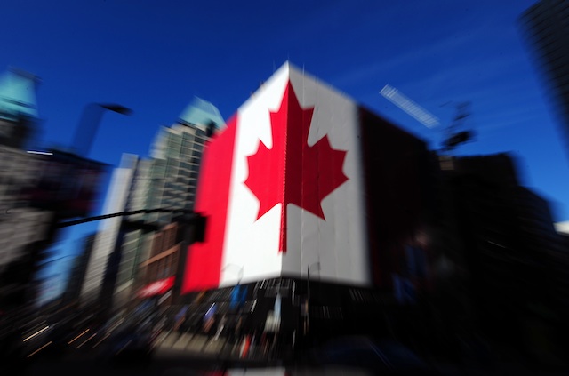 WELCOME, FOREIGN STUDENTS. Canada plans to lure more foreign students to its shores in the hopes of boosting innovation in the North American nation. Photo of a Canadian flag in Vancouver by Hannibal Hanschke/EPA/10Feb2010
