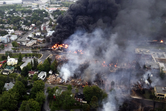 RAIL DISASTER. An aerial photograph shows a fire caused by the derailment of a 73-car freight train hauling crude oil in Lac-Megantic, Canada. File photo by EPA/Royal Canadian Mounted Police
