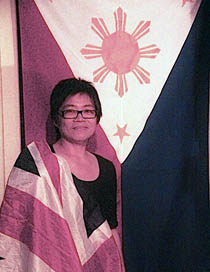TWO FLAGS. Writer Candy Quimpo Gourlay stands proud with the Philippine and British flags.