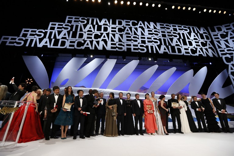 CANNES WINNERS. Winners and hosts stand on stage on May 26, 2013 after French-Tunisian director Abdellatif Kechiche won the Palme d'Or for the film "Blue is the Warmest Colour" during the closing ceremony of the 66th Cannes film festival in Cannes. Photo by Valery Hache/AFP