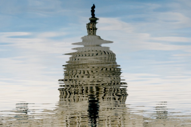 BROKEN IMAGE. The image of the US Capitol is reflected in the Capitol Reflecting Pool, during dusk on the fifteenth day of a partial shutdown of the federal government, in Washington DC, USA, 15 October 2013. EPA/Michael Reynolds