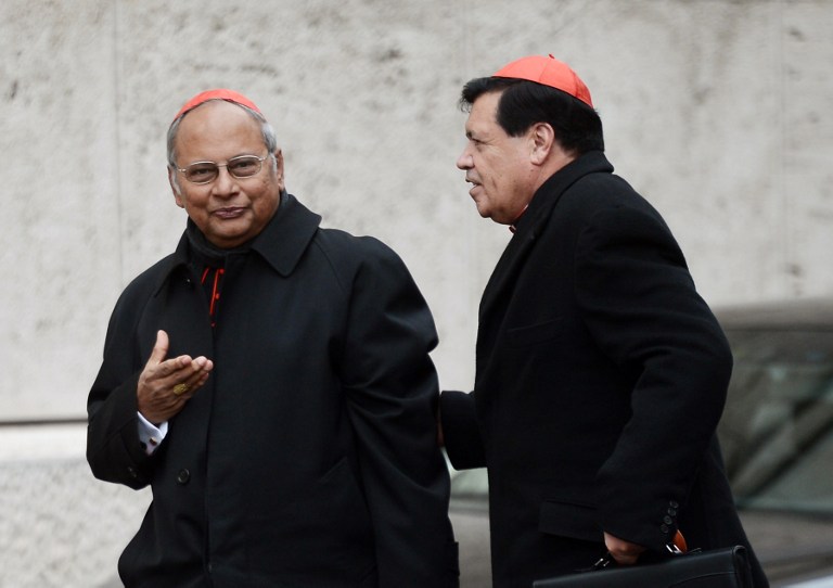NEXT POPE? Sri Lanka's cardinal Albert Malcolm Ranjith Patabendige Don (L) and Mexican cardinal Norberto Rivera Carrera arrive for an afternoon meeting of pre-conclave on March 8, 2013 at the Vatican. The day before, the next pope's ideal profile began to take shape as cardinals held a second day of pre-conclave talks -- a man with pastoral experience, missionary energy and few ties to the Vatican's unruly government. AFP PHOTO / FILIPPO MONTEFORTE