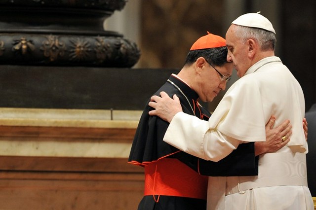 ‘SOLIDARITY IN HARDSHIP.’ Pope Francis hugs Manila Archbishop Luis Antonio Cardinal Tagle during a ceremony to bless the new image of Holy Pedro Calungsod of Philippines at St Peter's basilica on November 21, 2013 at the Vatican. All photos by Tiziana Fabi/AFP 