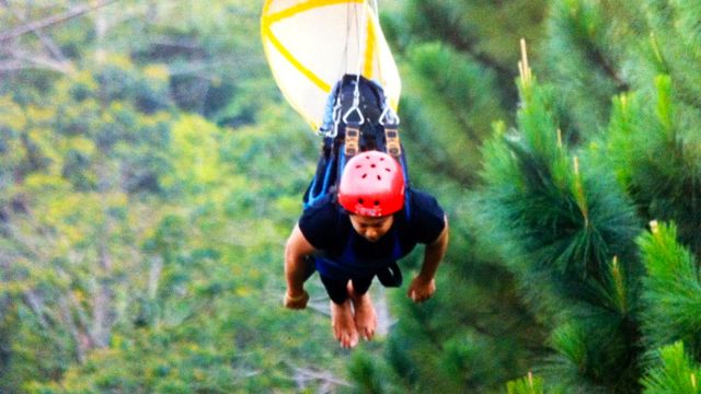THE AUTHOR IN DAHILAYAN, Bukidnon's 840-m zip line. Photo from the Dahilayan Adventure Park operators