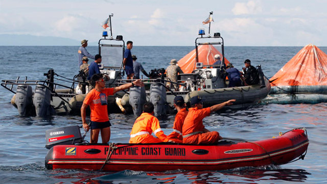 SEARCH ON. Rescuers are still looking for more than 100 missing. Photo by EPA/Dennis Sabangan