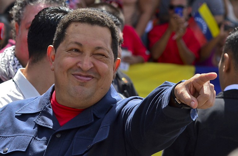 Venezuelan President Hugo Chavez gestures before voting in Caracas on October 07, 2012. AFP PHOTO/Luis Acosta