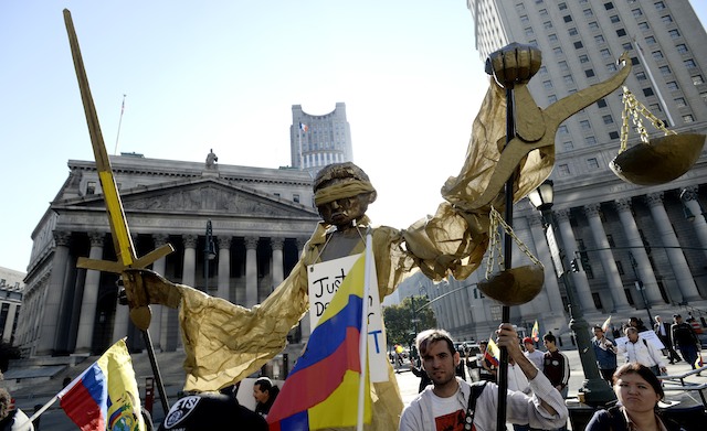 SUPPORT FOR ECUADOR. People representing Ecuadorians carry a giant puppet near a United States court house to show support for a pollution judgment against the Chevron Corp in New York, New York, USA, 15 October 2013. EPA/Justin Lane