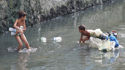 Kids collect plastic bottles. Photo courtesy of ILO