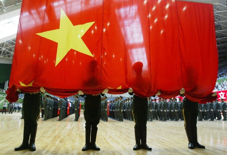 MILITARY MIGHT. In this file photo, hundreds of elite police and soldiers attend a send-off ceremony as they prepare for the security during China's 60th anniversary celebration in Beijing on June 23, 2009. Photo by AFP