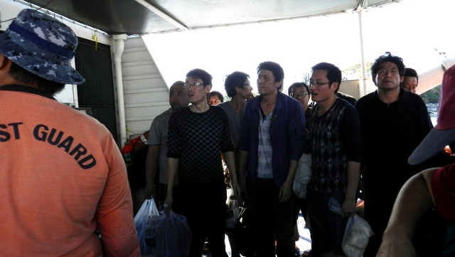 IN TROUBLE. The 12 Chinese fishermen on board the Chinese vessel that got stuck in Tubbataha arrive in Puerto Princesa City Wednesday, April 10. Photo by Terry Aquino/Tubbataha Management Office