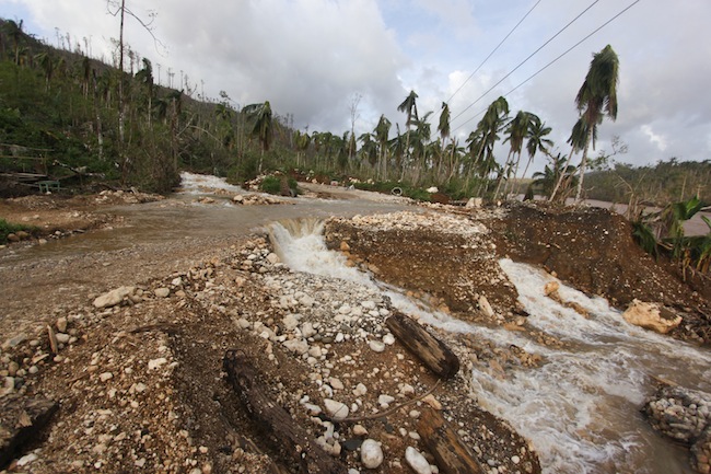 ROAD TO RIVER. A portion of the Cateel-Compostela road was transformed into a small waterfall. Photo by Karlos Manlupig.