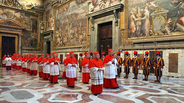 SOLEMN PROCESSION. Cardinals sing to the Holy Spirit while marching to the Sistine. File photo from AFP