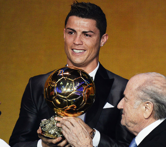 BACK ON TOP. Real Madrid's Portuguese striker Cristiano Ronaldo receives the FIFA Men's World Player of the Year 2013 award from FIFA President Sepp Blatter during the FIFA Ballon d'Or 2013 gala at the Kongresshaus in Zurich, Switzerland. Photo by Steffen Schmidt/EPA