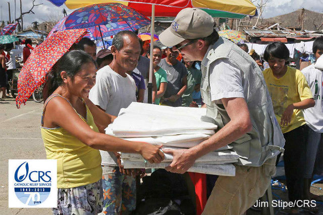 SETTING AN EXAMPLE. Catholic Relief Services (CRS), US-based non-profit organization, helps survivors of Super Typhoon Yolanda (Haiyan). Photo courtesy of Jim Stipe/CRS
