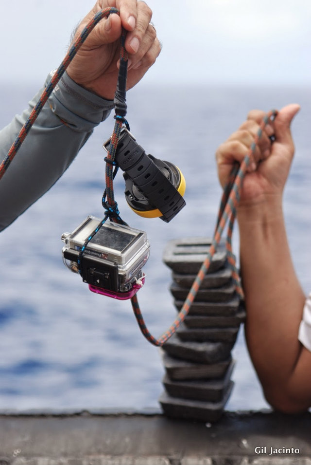 MINI-CAMERAS. Using weights (right), researchers place a GoPro mini-camera (left) under the sea, along with a dive computer. Photo courtesy of Dr Gil Jacinto/UP-MSI