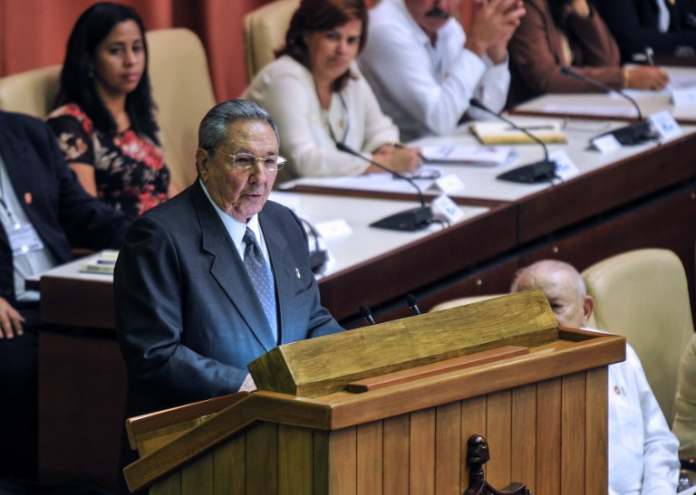 Cuban reelected President Raul Castro (L) delivers a speech during the new National Assembly meeting to choose a Council of State, at the Conventions Palace in Havana on February 24, 2013. AFP PHOTO/ADALBERTO ROQUE 
