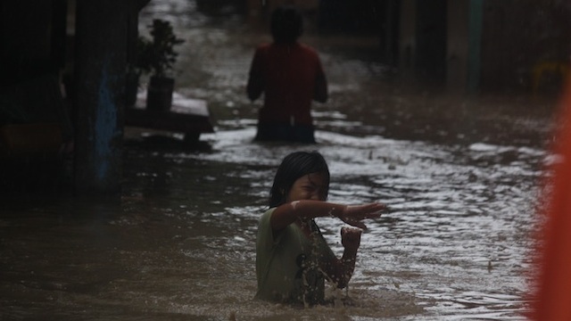 A girl wades through floodwaters in Davao City, January 20, 2013. Photo by Karlos Manlupig.
