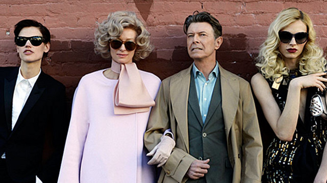 COOL COUPLE. Tilda Swinton (second from left, in pink) and David Bowie (3rd from left) in the music video of 'The Stars (Are Out Tonight).' Photo from the David Bowie Facebook page