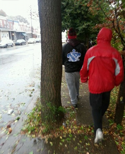 Photo by Jarrett Burks of friends braving the rain in Wilmington, DE