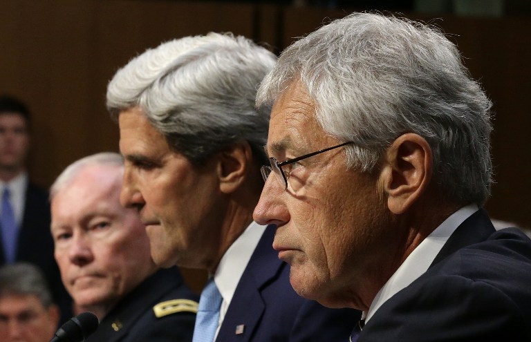 FACING THE SENATE. US Chairman of the Joint Chiefs of Staff Gen. Martin Dempsey, US Secretary of State John Kerry, and US Defense Secretary Chuck Hagel testify before the Senate Foreign Relations Committee on the topic of "The Authorization of Use of Force in Syria" September 3, 2013 in Washington, DC. Chip Somodevilla/Getty Images/AFP