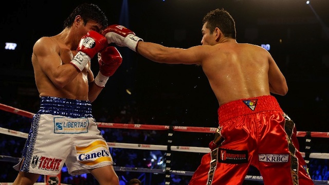 ALWAYS IN CONTROL. Nonito Donaire of the Philippines (R) hits Jorge Arce of Mexico during their WBO World Super Bantamweight bout at the Toyota Center on December 15, 2012 in Houston, Texas. Scott Halleran/Getty Images/AFP