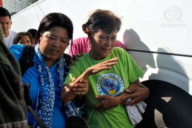 FREEDOM. Social workers assist former hostages to a vehicle that will take them to Camp Batalla for processing, September 17, 2013. Photo by LeAnne Jazul/Rappler