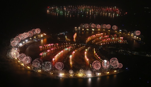 DAZZLING DISPLAY. Fireworks explode over Palm Jumeirah in Dubai on January 1, 2014 to celebrate the new year as Dubai kicked off New Year with a dazzling bid for a new world record to cap those the Gulf city state already holds for its mammoth property developments. Photo by AFP