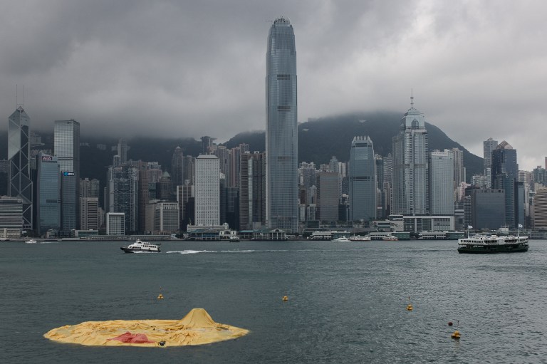 DUCK DOWN. The 16.5-meter-tall inflatable Rubber Duck art installation lies deflated in Hong Kong's Victoria Harbour on May 15, 2013. Organizers said the inflatable Rubber Duck created by Dutch artist Florentijn Hofman had been deflated for scheduled maintenance, but visitors who had made the trip to see it were left disappointed. AFP PHOTO / Philippe Lopez
