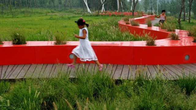RED RIBBON. A 'red ribbon' pathway doubles as a seat and provides lighting. Photo from www.architizer.com