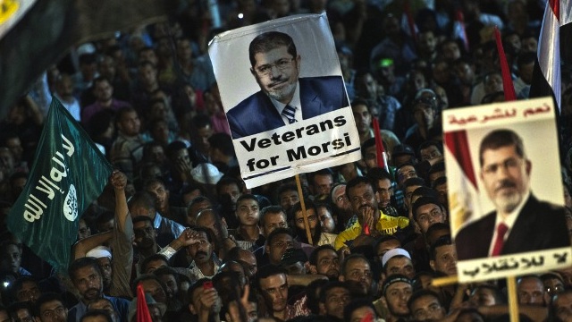 MORSI SUPPORTERS.  Members of the Muslim Brotherhood and other supporters of Egypt's ousted president at a sit-in protest outside the Rabaa al-Adawiya mosque in Cairo last year. File photo by AFP/Khaled Desouki