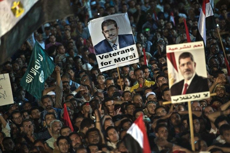 ANGER IN CAIRO. Members of the Muslim Brotherhood and supporters of Egypt's ousted president Mohammed Morsi take part in a sit-in protest outside the Rabaa al-Adawiya mosque in Cairo on August 12, 2013. Photo by AFP/Khaled Desouki